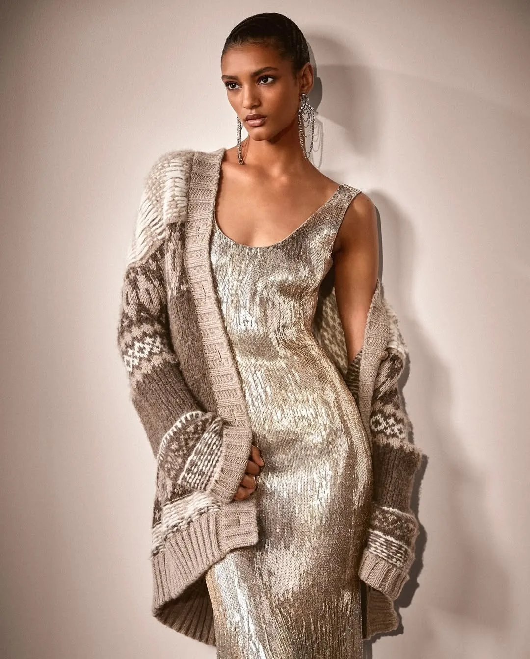 Gold sequin slip dress under a chunky Fair Isle cardigan