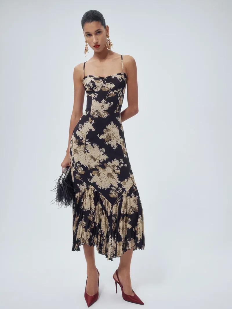 Reformation Aiko slip dress in a dark floral print with a ruffled hem