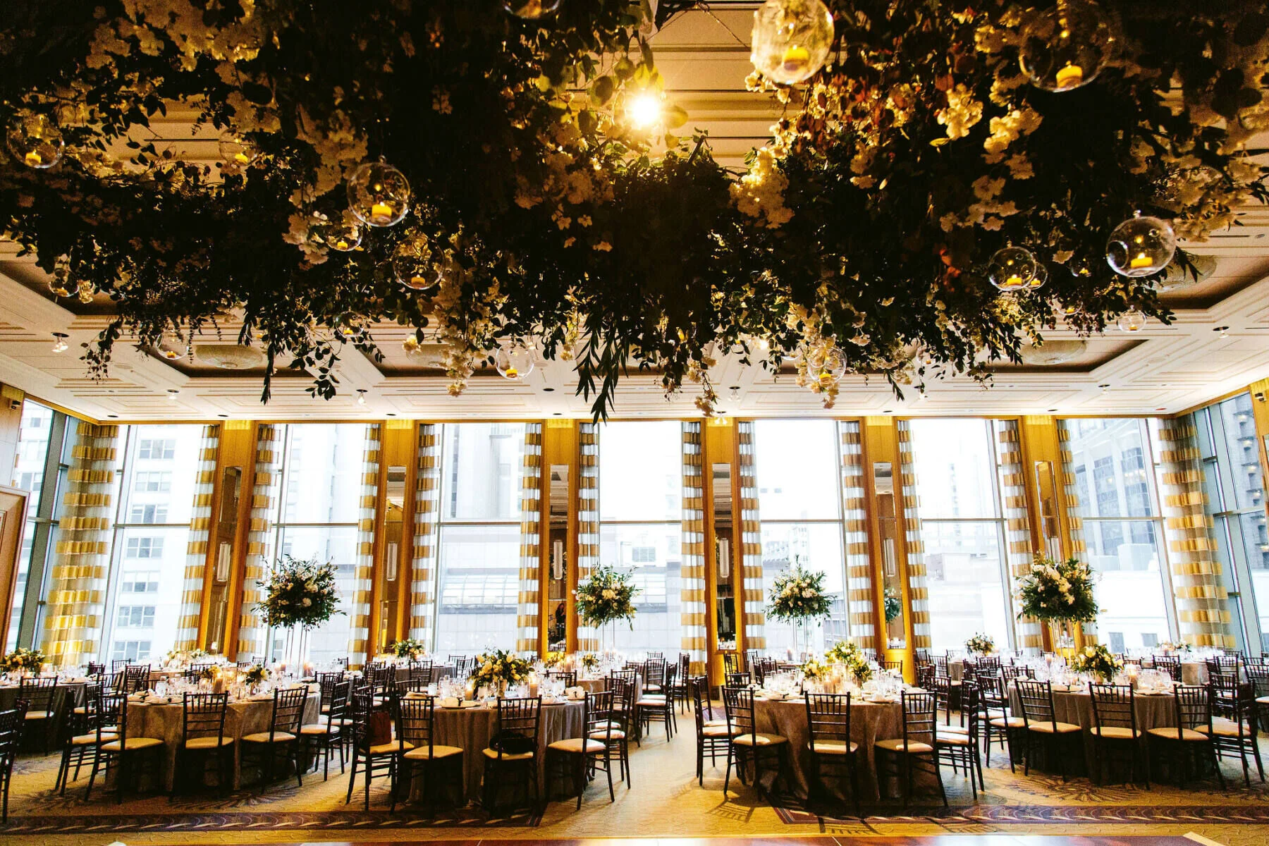 Ballroom wedding venues: Blooms add to the personality of this glamorous wedding at The Peninsula Chicago in Chicago, Illinois. 