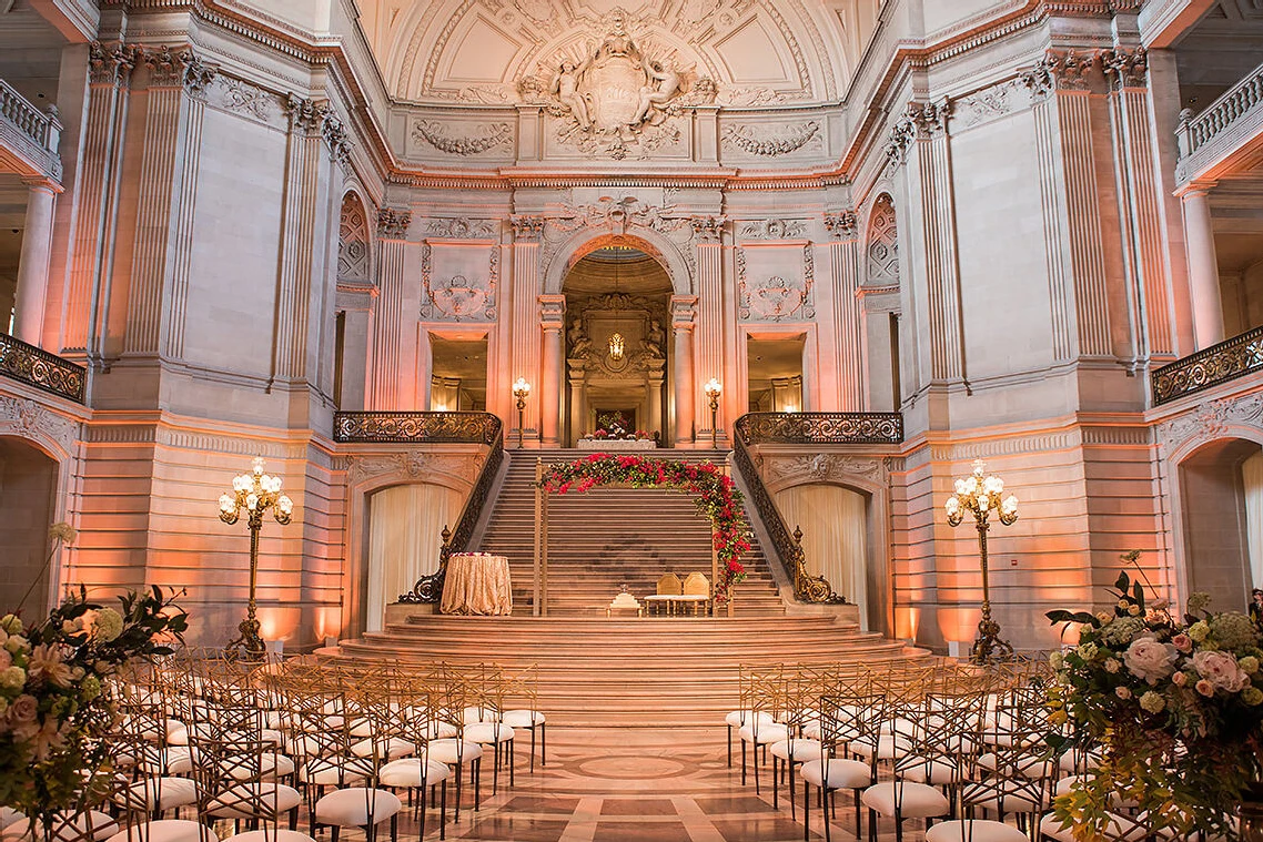 Celebrity Wedding: An indoor ceremony setup on the floor of San Francisco's City Hall.