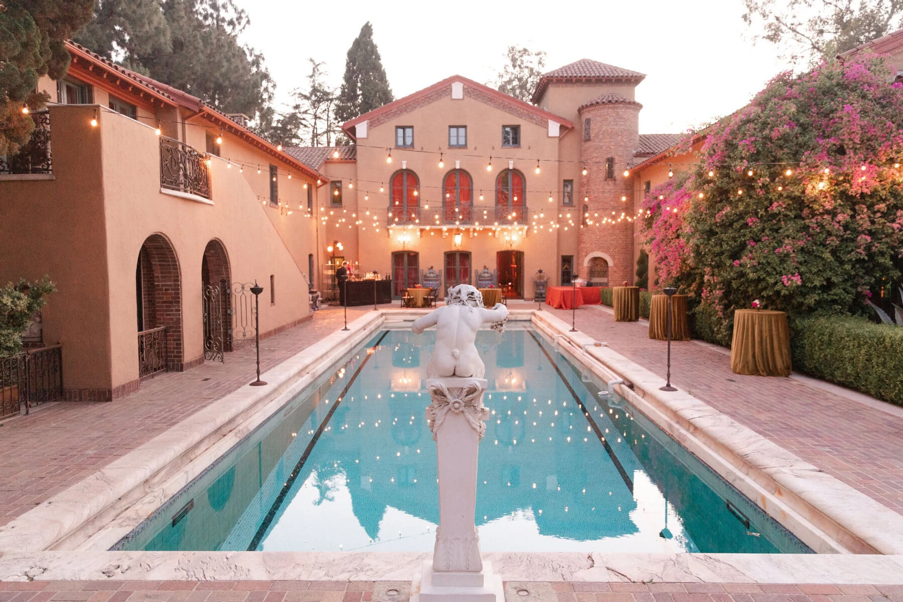 Celebrity Wedding: Pulled back view of the Paramour Estate courtyard glowing at at golden hour