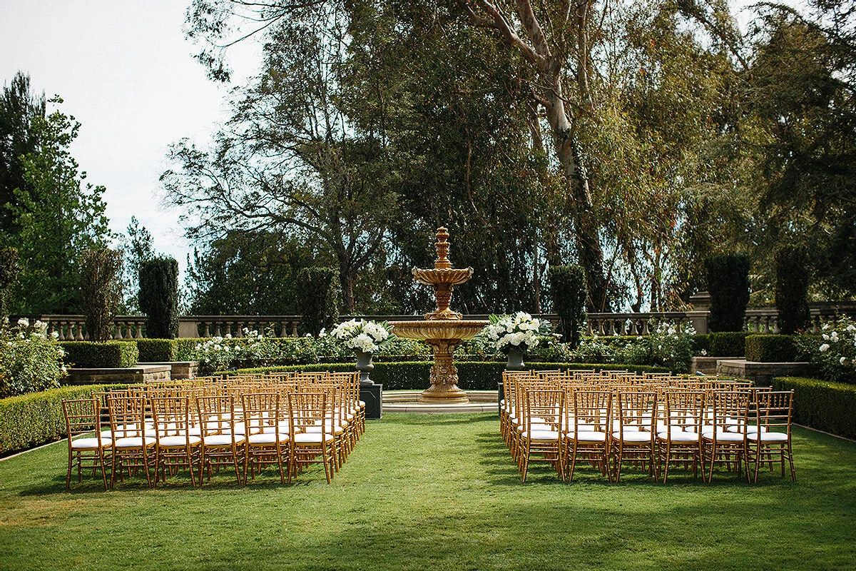 Celebrity Wedding: An outdoor ceremony setup overlooking a fountain and trees in Los Angeles.