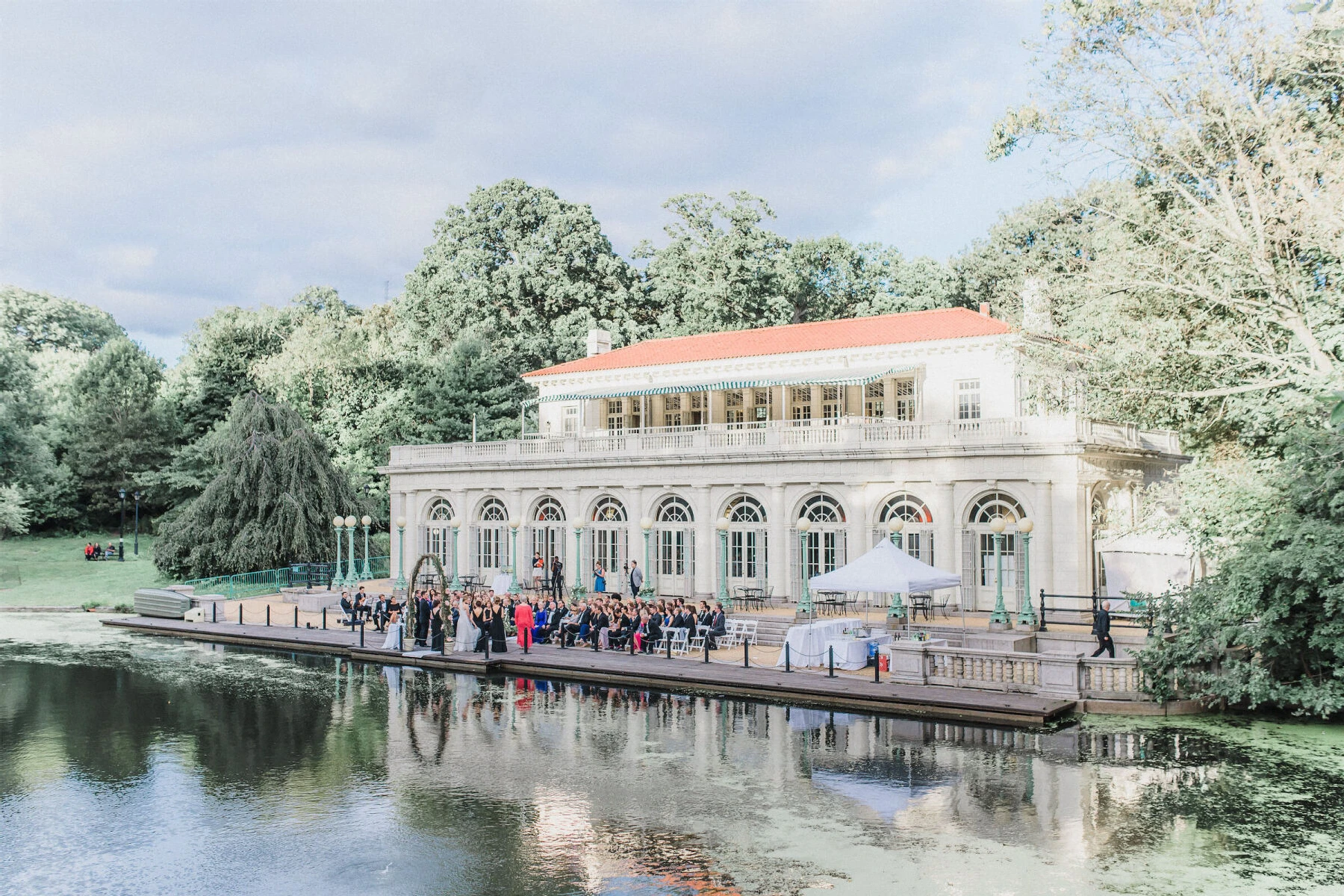 Celebrity Wedding: A boathouse in Brooklyn with an outdoor wedding ceremony setup on the patio.