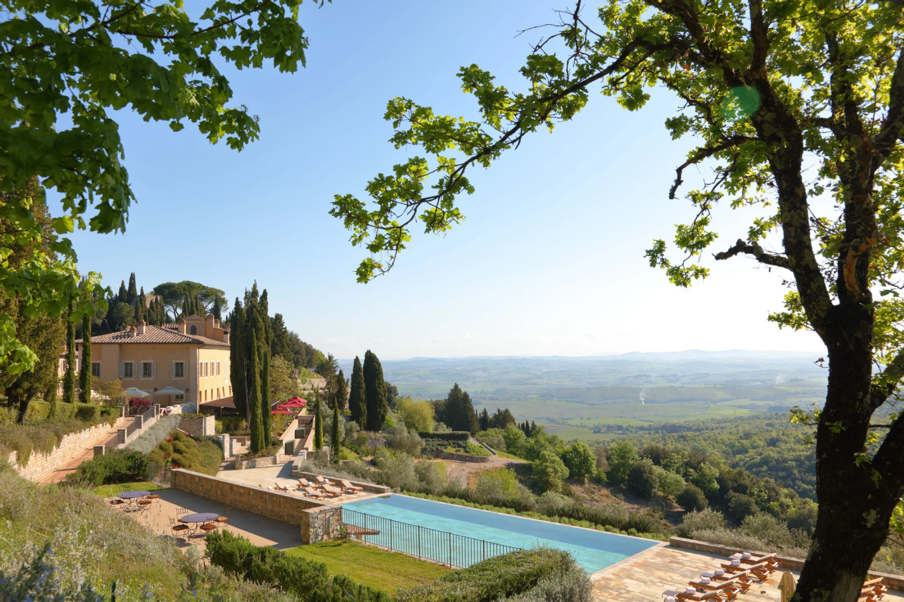 Celebrity Wedding: A luxury hotel in Tuscany, which has a pool overlooking the rolling Tuscan hills beyond.