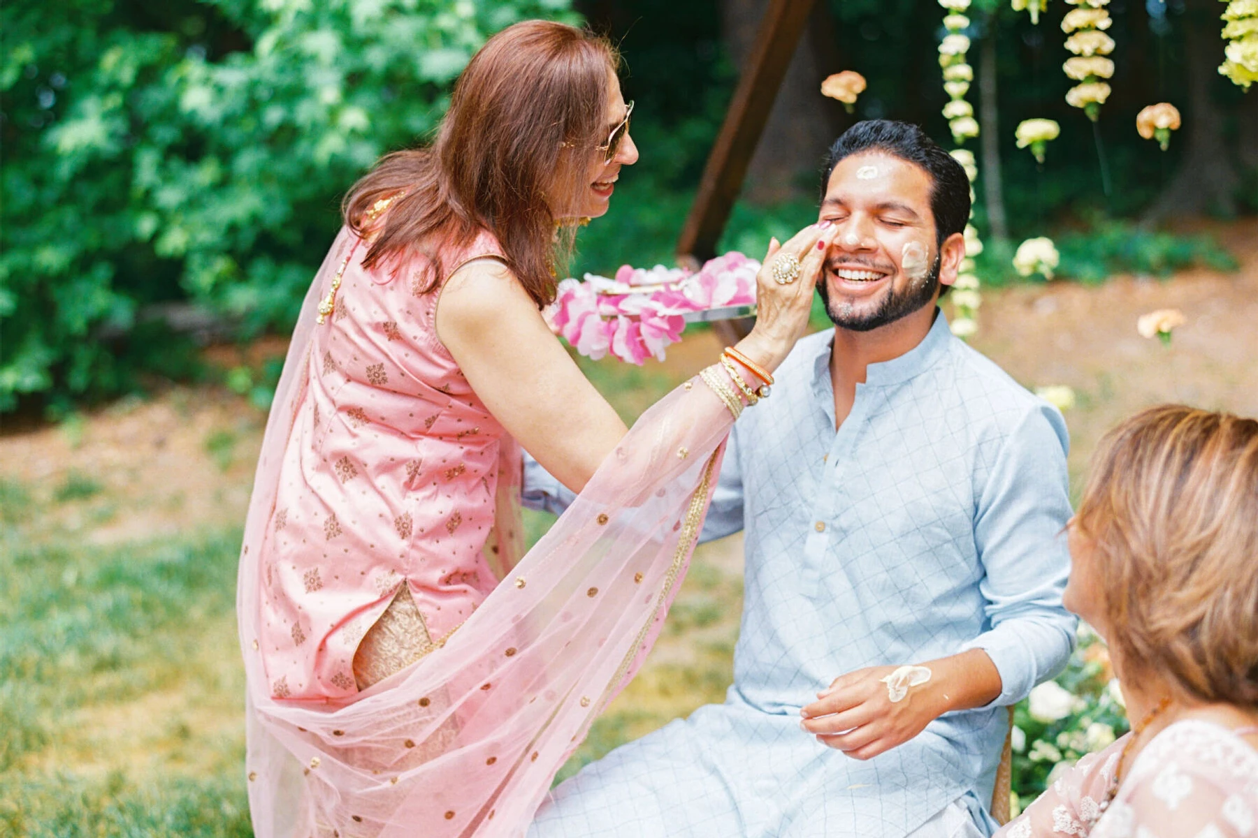 The haldi ceremony transpired the afternoon before the big day during this destination Indian wedding weekend in North Carolina. As per tradition, the groom was covered in tumeric paste.