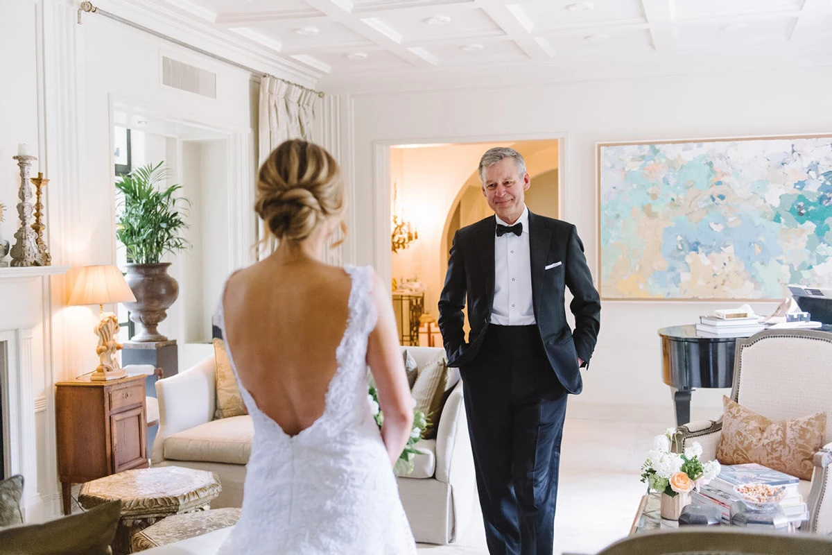 First Look Photos: An emotional father looking at his daughter on her wedding day.