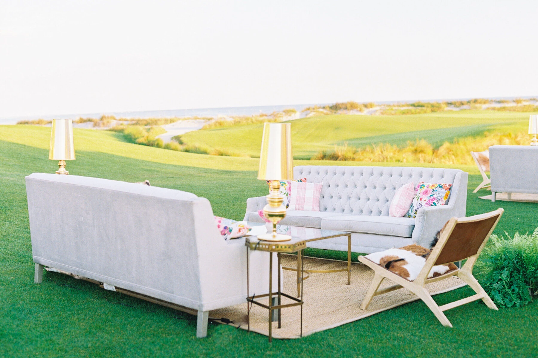 Golf Course Wedding Venues: Furniture that was placed on a golf course for a wedding reception.