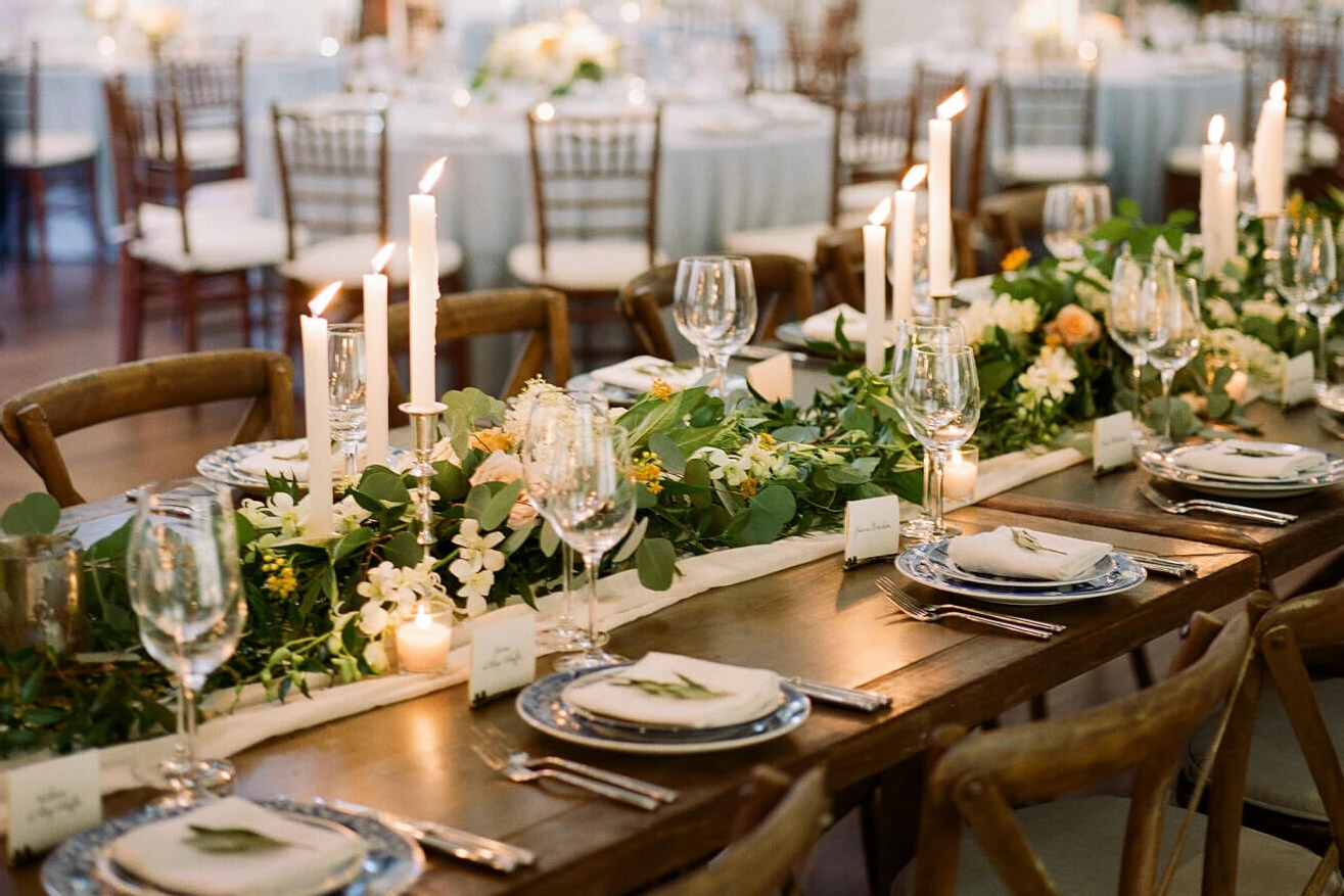 Wedding tablescape with flowers, candles, plates 