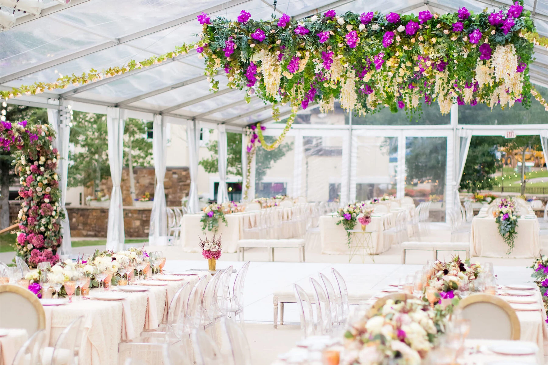 Tables and flower hanging installation at wedding