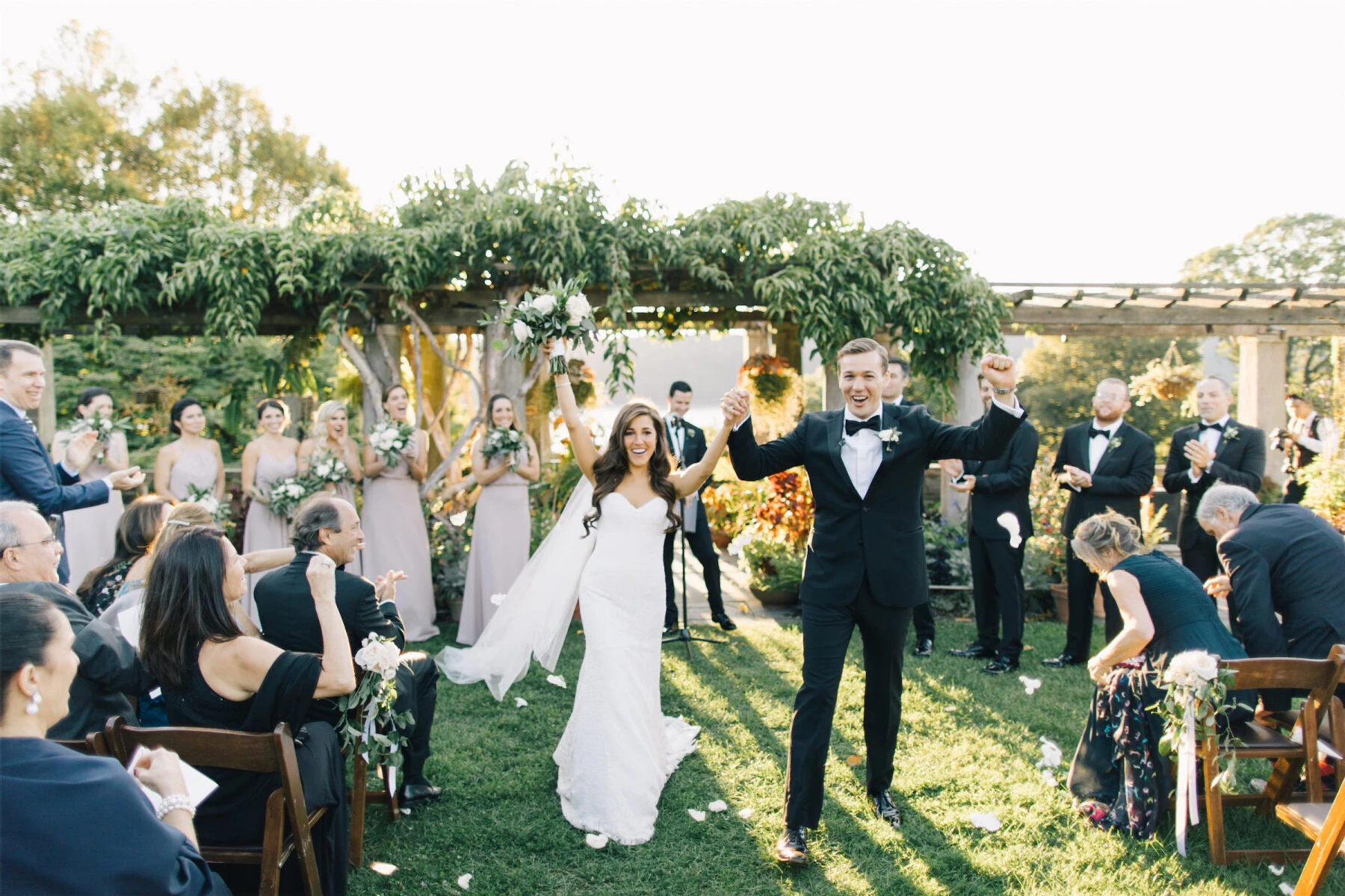 Couple walking down the aisle at an outdoor wedding 