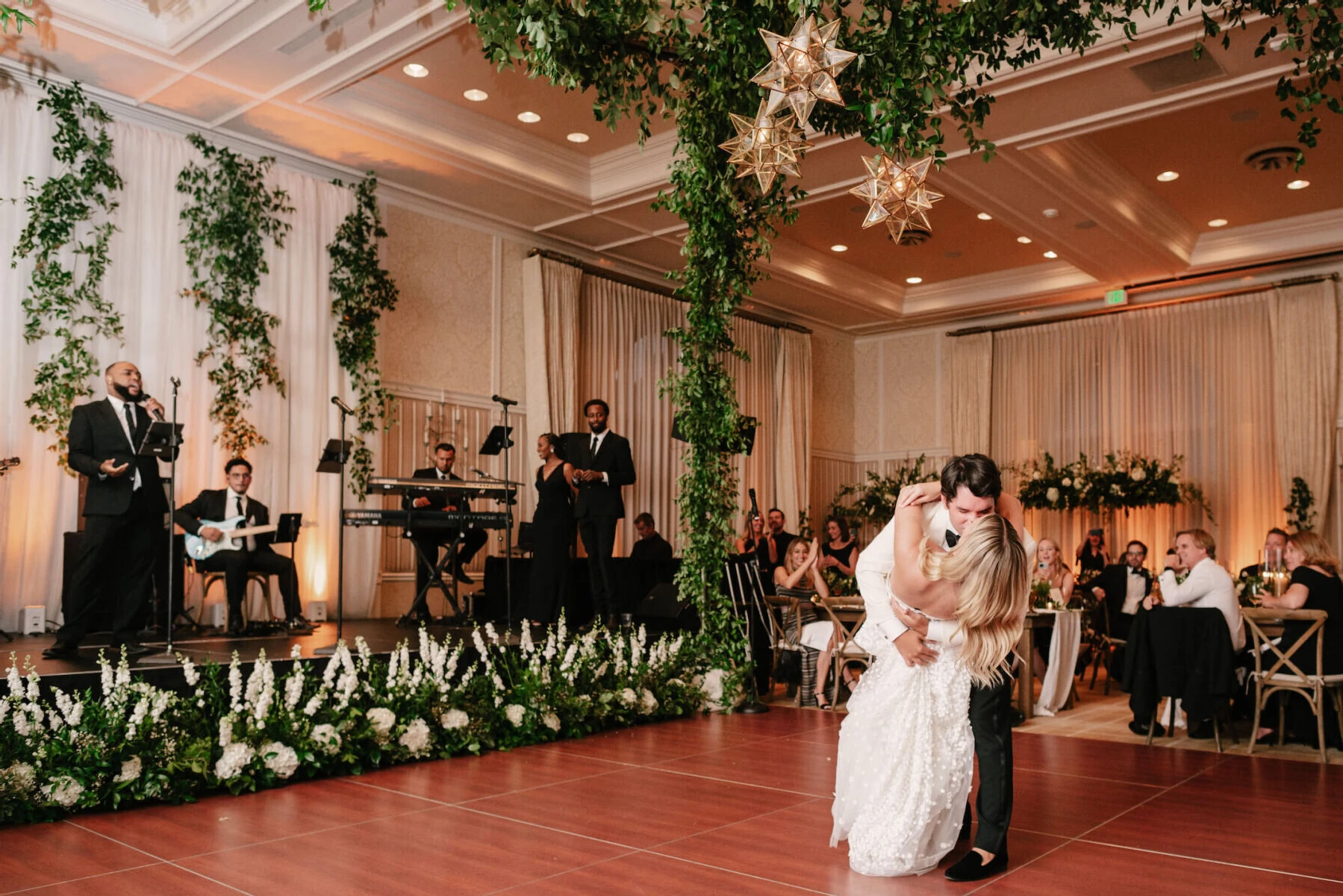 Mountain wedding details: A newlywed couple kiss during their first dance inside the ballroom at Hotel Jerome.