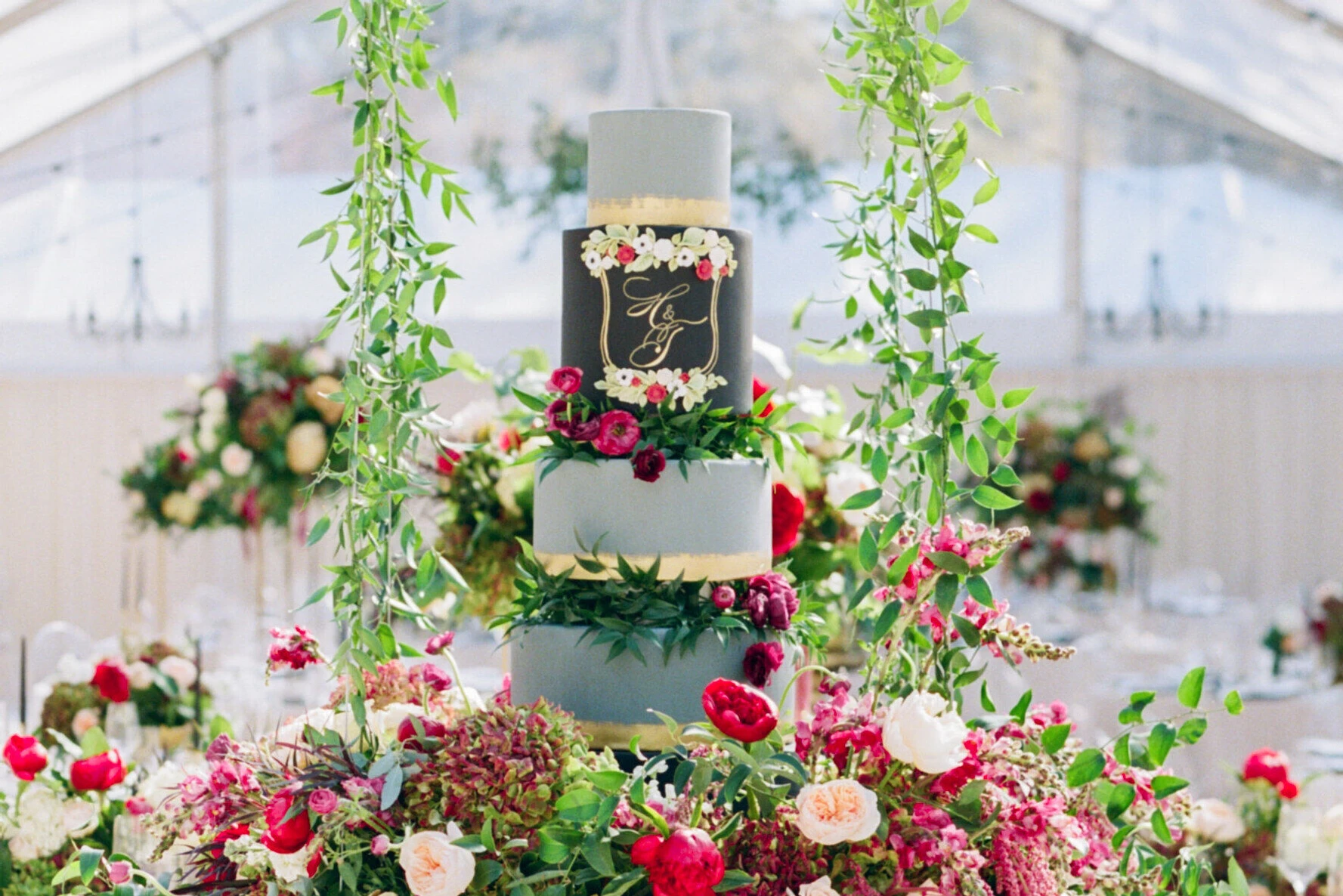 Wedding cake bakery: an ornate, colorful floral cake display. 