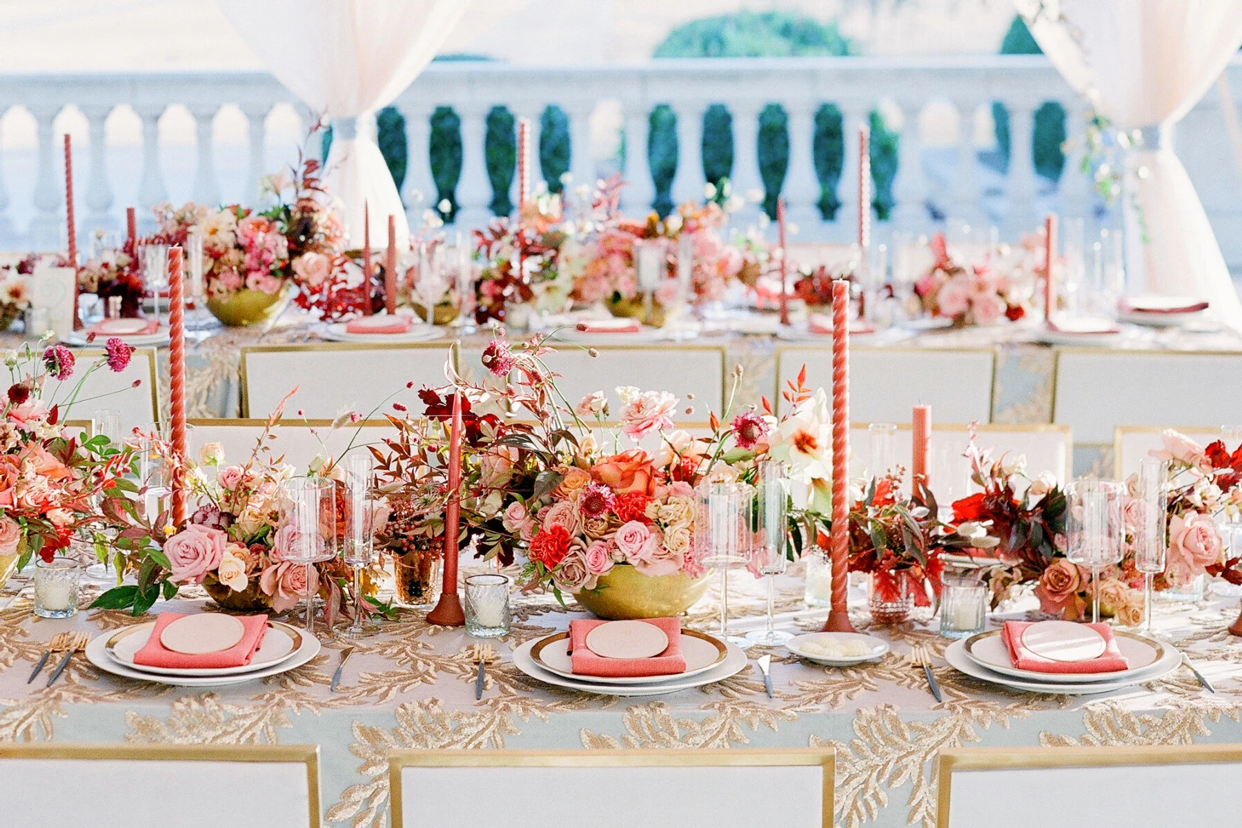 Wedding details: the coral and red table scape at Kirby & Adam's Texas wedding