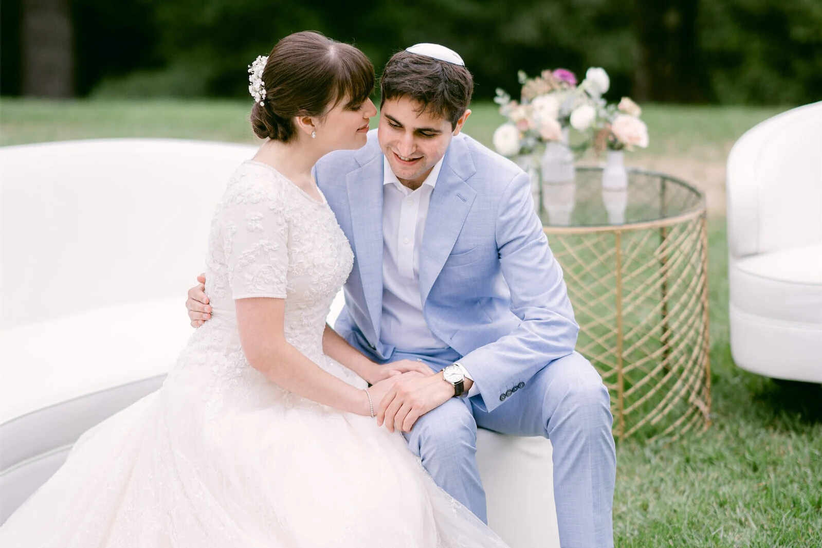 Wedding details: Wedding couple sitting in the garden of their wedding reception enjoying an intimate moment together