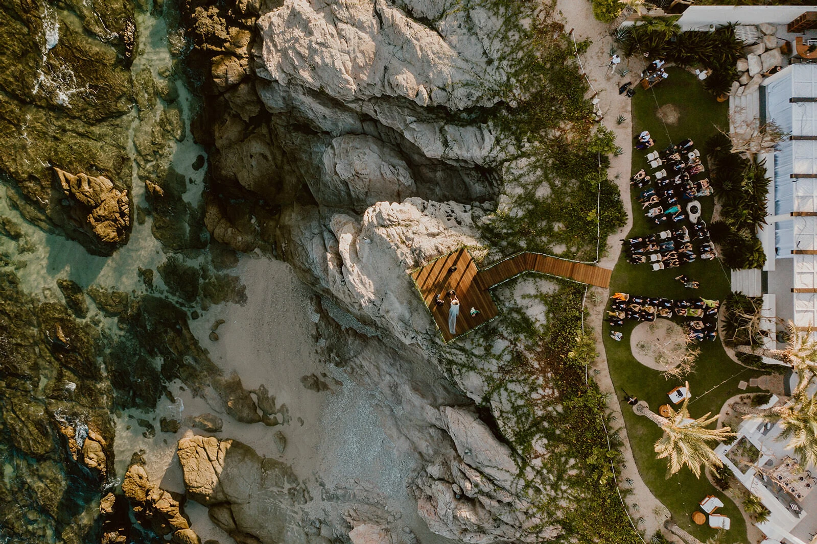 An overhead drone photograph of a waterfront Cabo wedding.